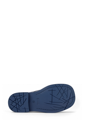 The soles of MIL 1978 Blue Leather Moccasin