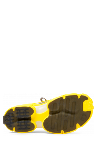The soles of Tossu Yellow caged sneakers