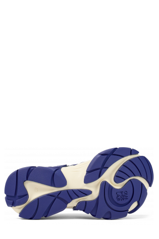 The soles of Tormenta Blue and white sneakers