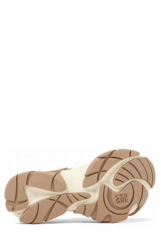 The soles of Tormenta Beige and white sneakers
