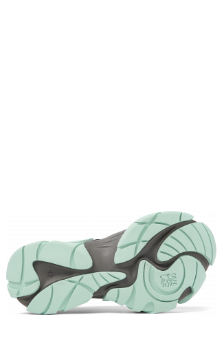 The soles of Tormenta Gray and light green sneakers
