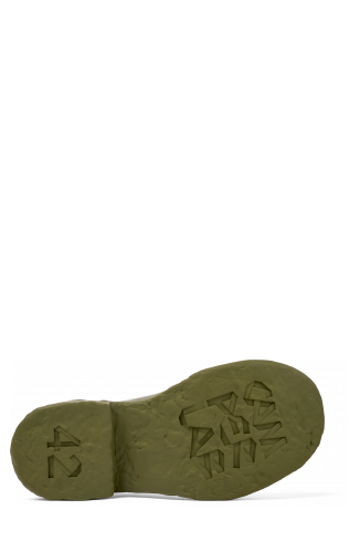 The soles of Vamonos Green Leather Wallabee Shoe