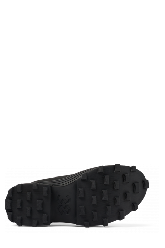 The soles of Traktori Black Textile Clog