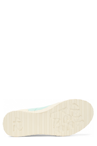 The soles of Roz Light green recycled cotton sneakers