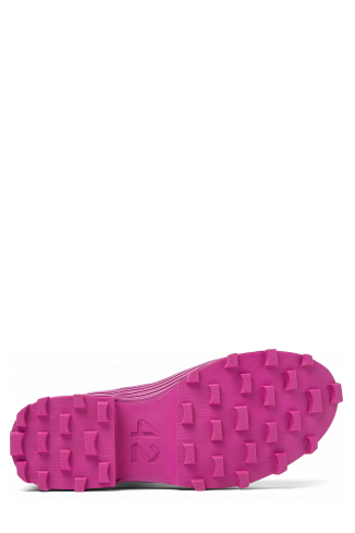 The soles of Traktori Purple leather boots