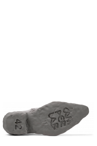 The soles of Venga Gray leather boots