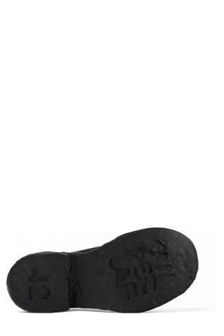The soles of Vamonos Black Leather Boots