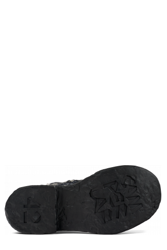 The soles of Vamonos Gray Leather Boots