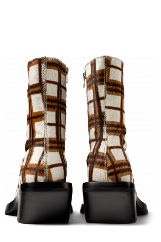 Back view of QUETAL Cream-brown tartan hair-on-leather boots