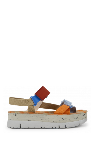 Side view of Oruga Up Beige, blue, and red sandals for women