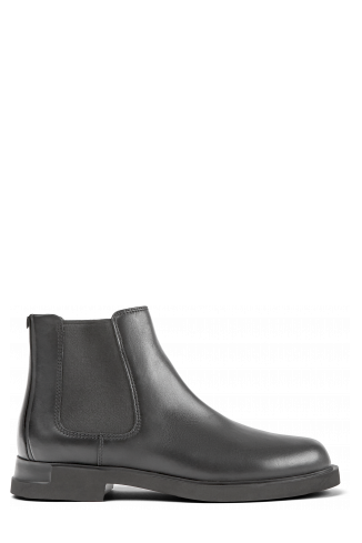 Side view of Iman Black leather chelsea boots for women