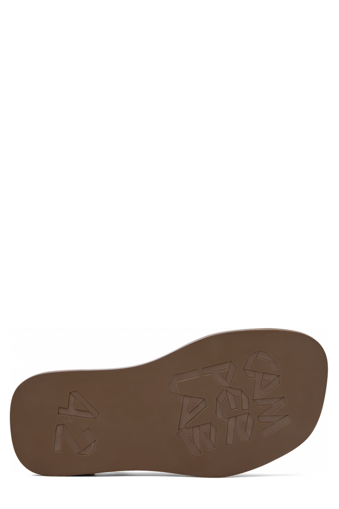 The soles of Nada Brown Leather Sandals