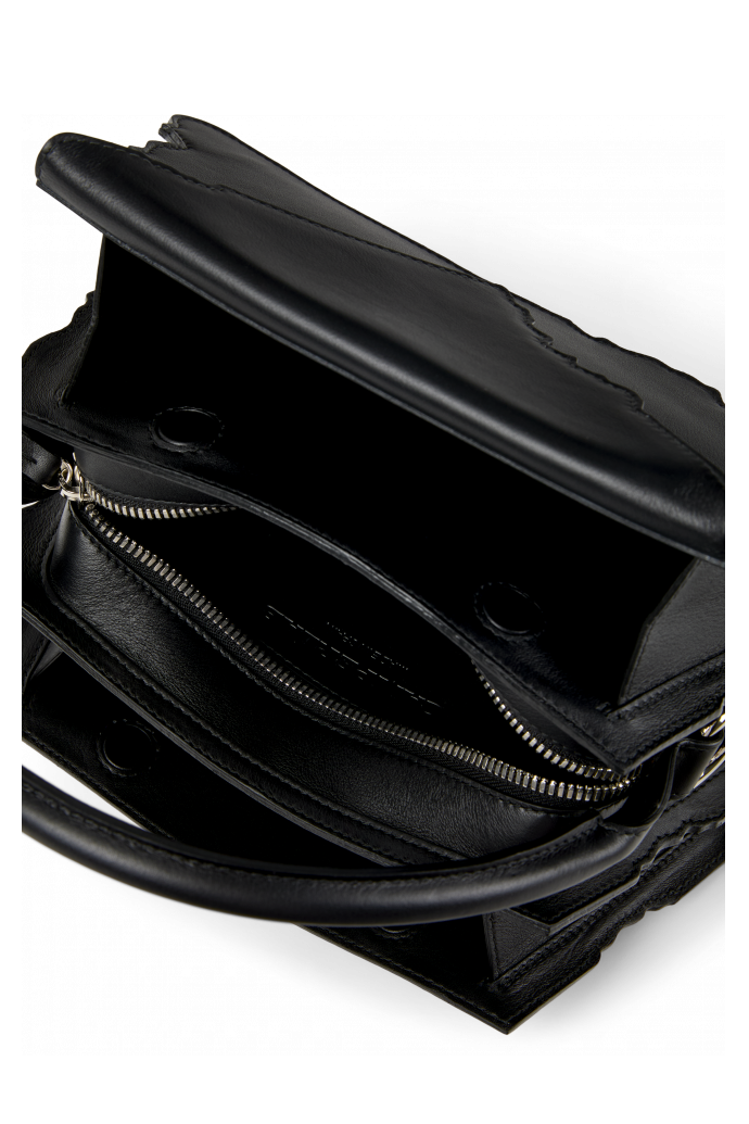 Overhead view of HANURI Black leather accordion shoulder bag