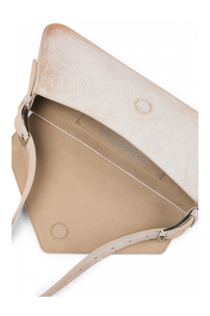 Overhead view of KIRJE White cracked leather handbag