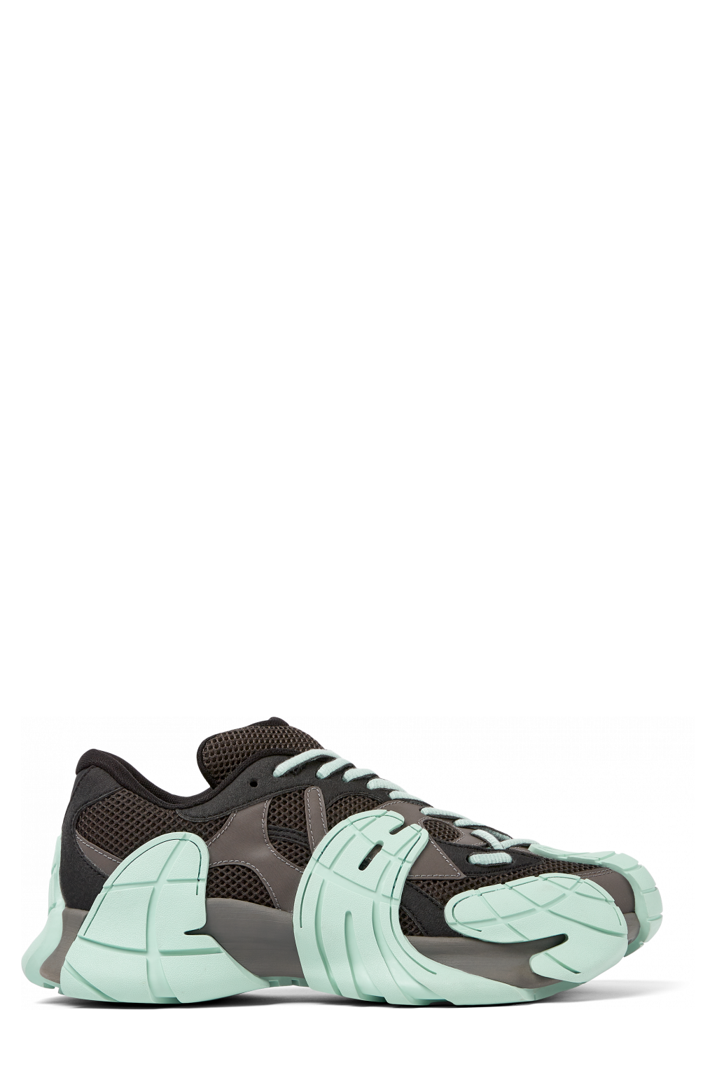 Side view of Tormenta Gray and light green sneakers